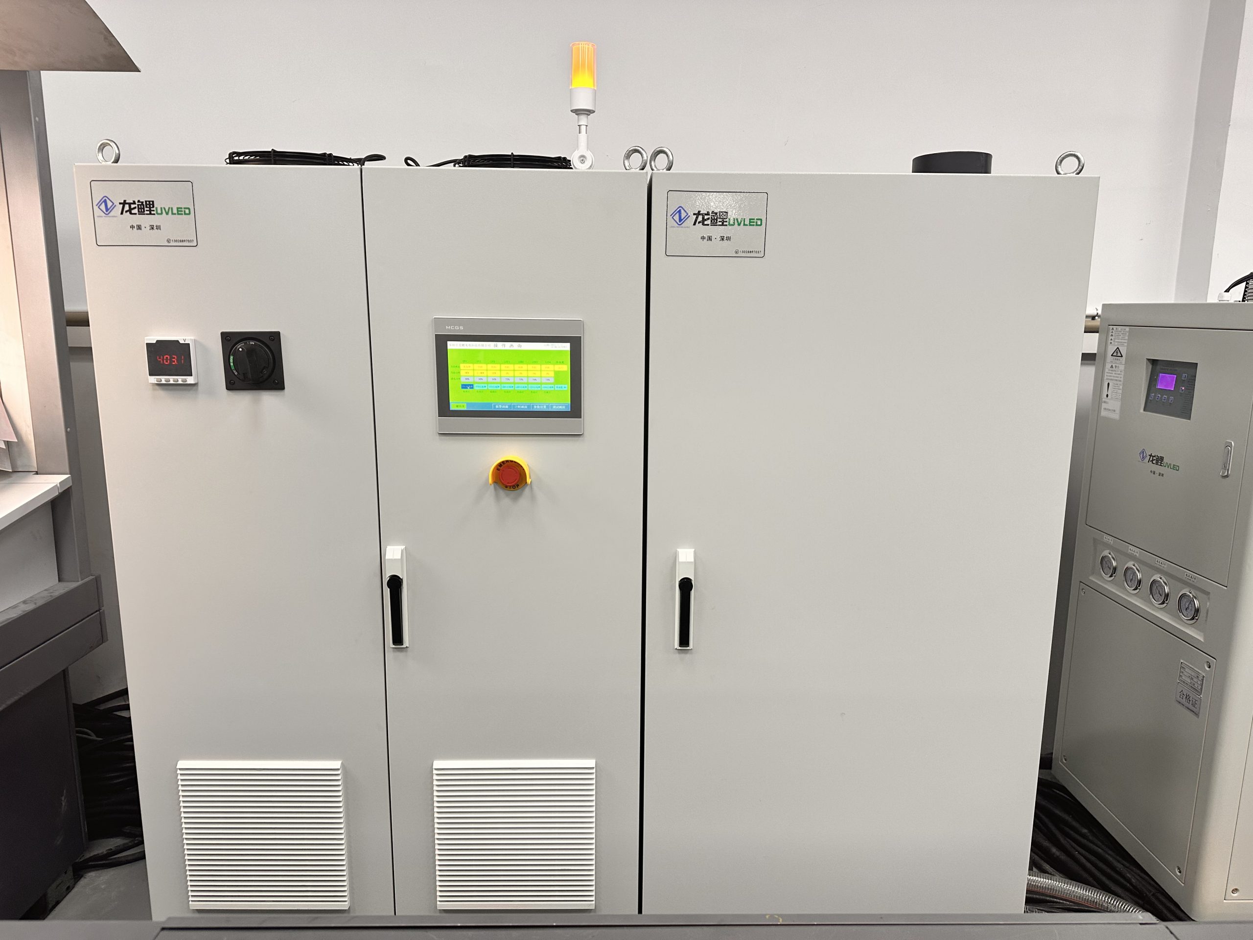 Floor-standing UV LED curing control cabinet with integrated touchscreen controls and cooling ventilation.